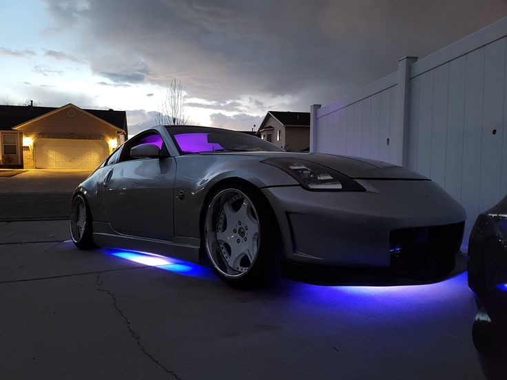 Under car glow kit on silver coupe in blue multi colour mode.
