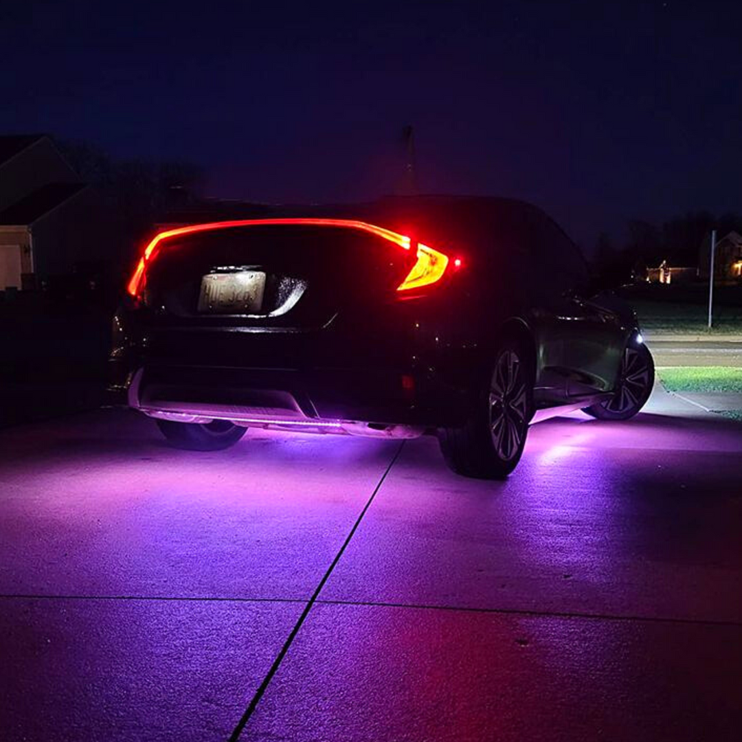 Car Underglow kit purple lights on car in driveway